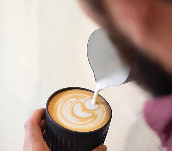 Latte art in charcoal reusable cup