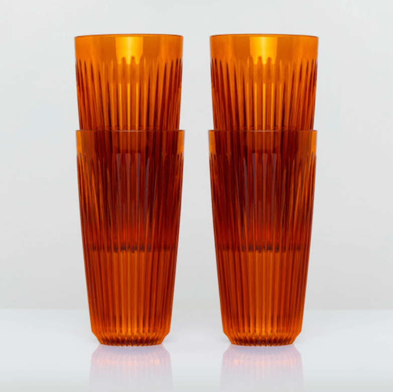 Two stacks of amber 16oz HuskeeRenew cups